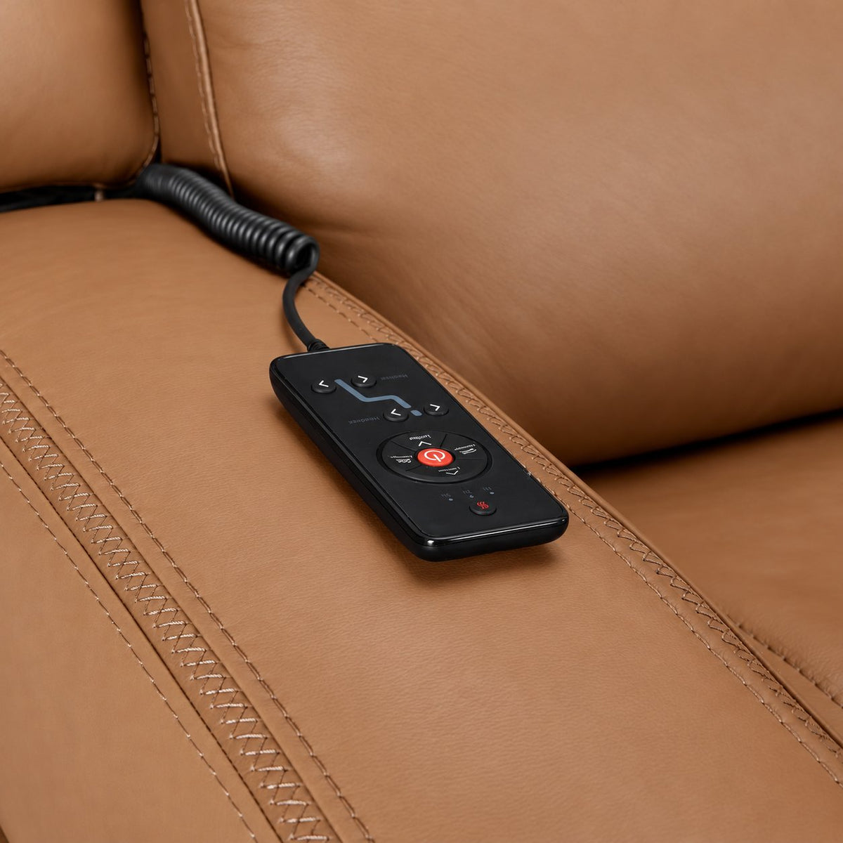 Jackson butternut leather sofa close-up showing wired remote for power recline, heat and massage controls