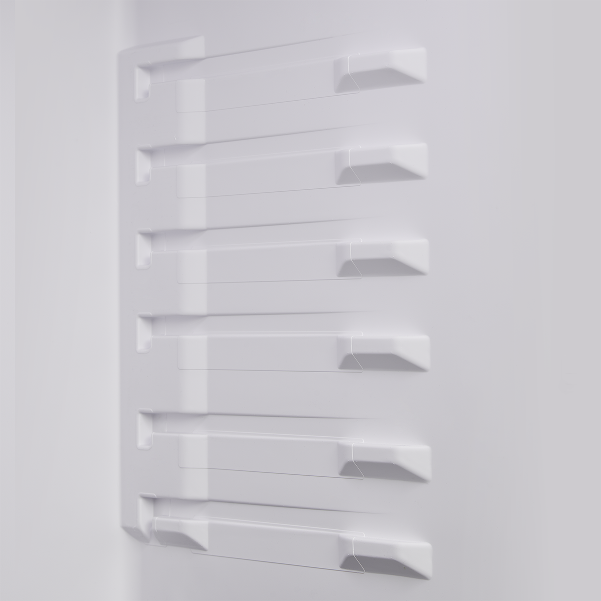 Interior air channels designed to distribute cool air across the refrigerator