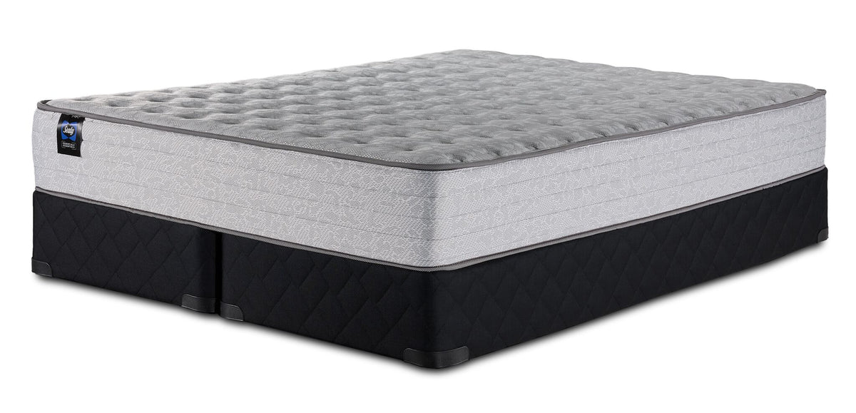 Sealy Burchelle Extra Firm Tight Top King mattress and black split boxspring set, three-quarter view
