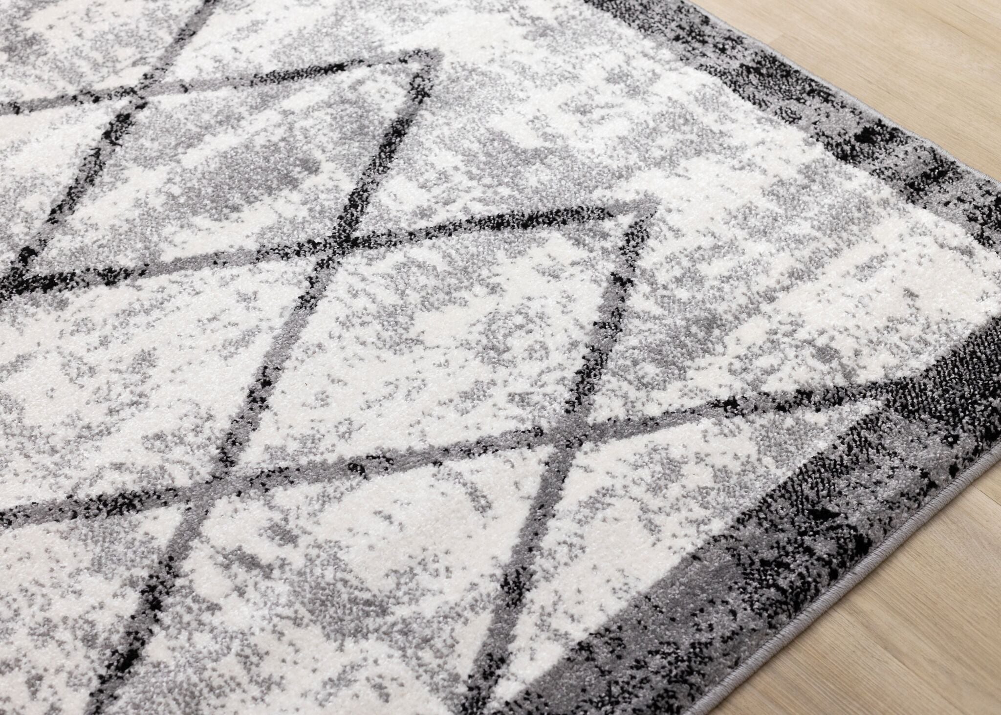 Ashwood 6'7" x 9'10" Distressed Lattice Area Rug - Grey, Black, White