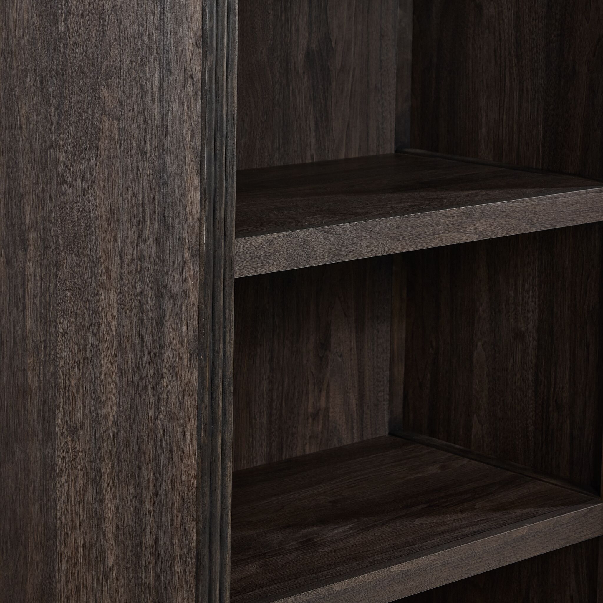 Modern Edge bookcase close-up showing dark grey finish, shelf edge and frame moulding