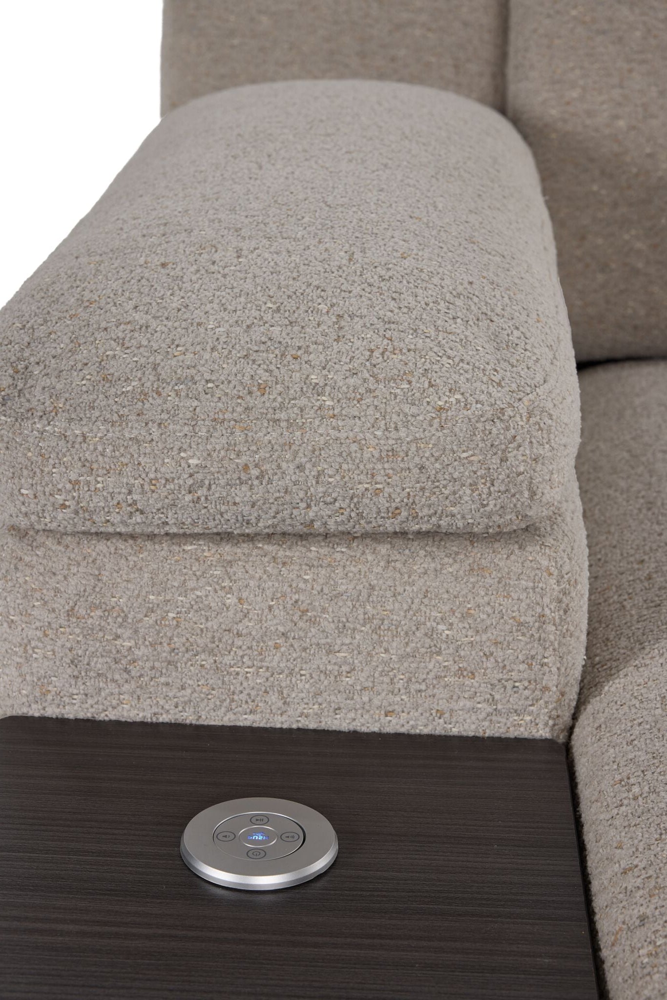 Close-up of Slayden right-facing taupe sectional showing padded armrest, side table and control panel