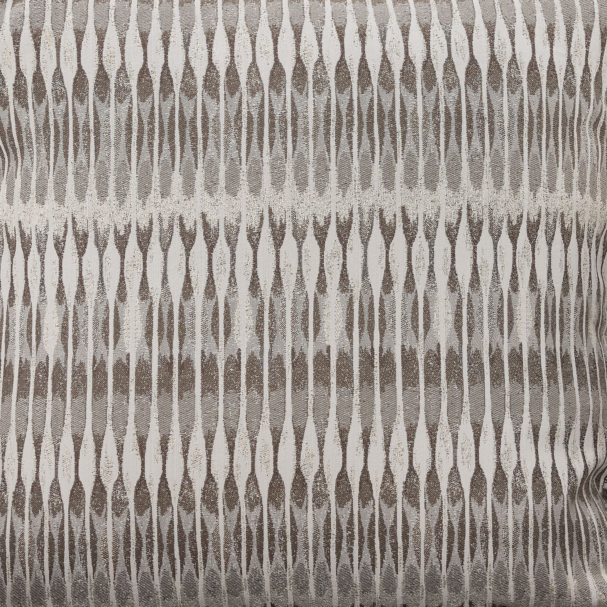 Tresor sofa accent pillow close-up with light neutral patterned fabric