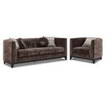 Tresor dark brown sofa and chair set with curved backs, button-tufted detail and accent pillows