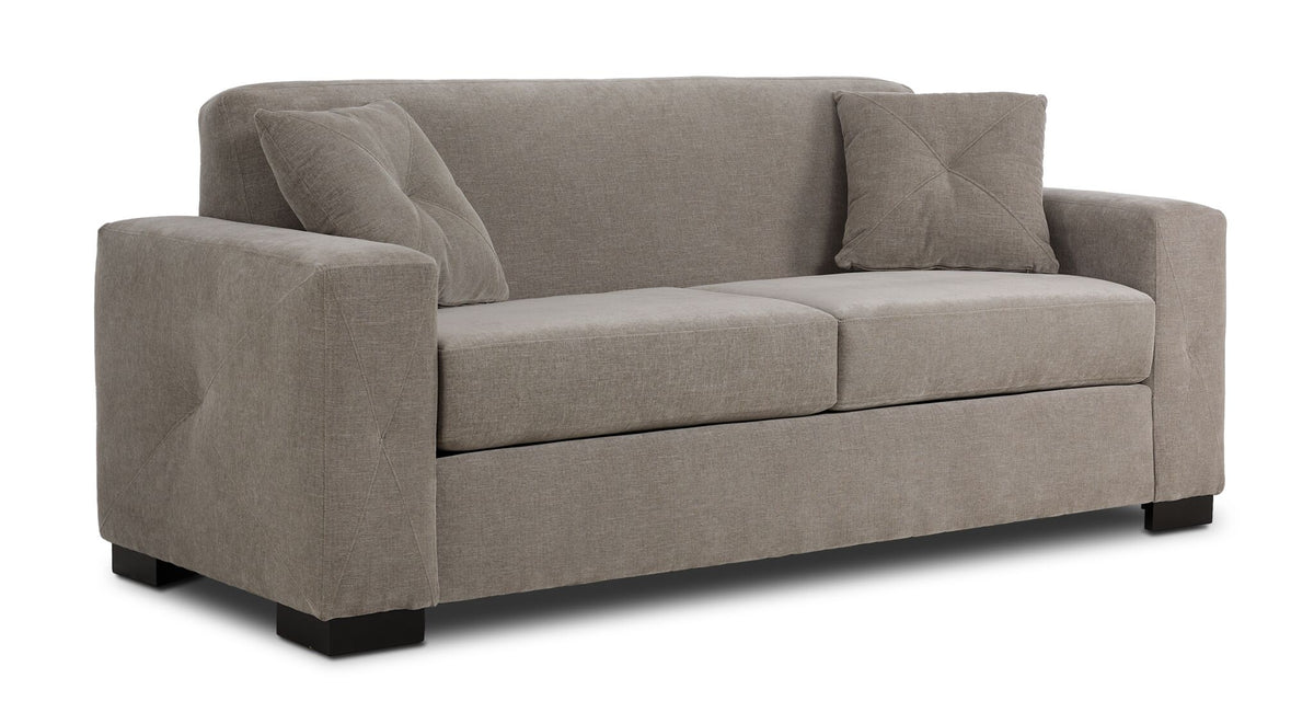 Valetta Sofa - Wheat angled view with two seat cushions, wide track arms, dark block feet and two accent pillows