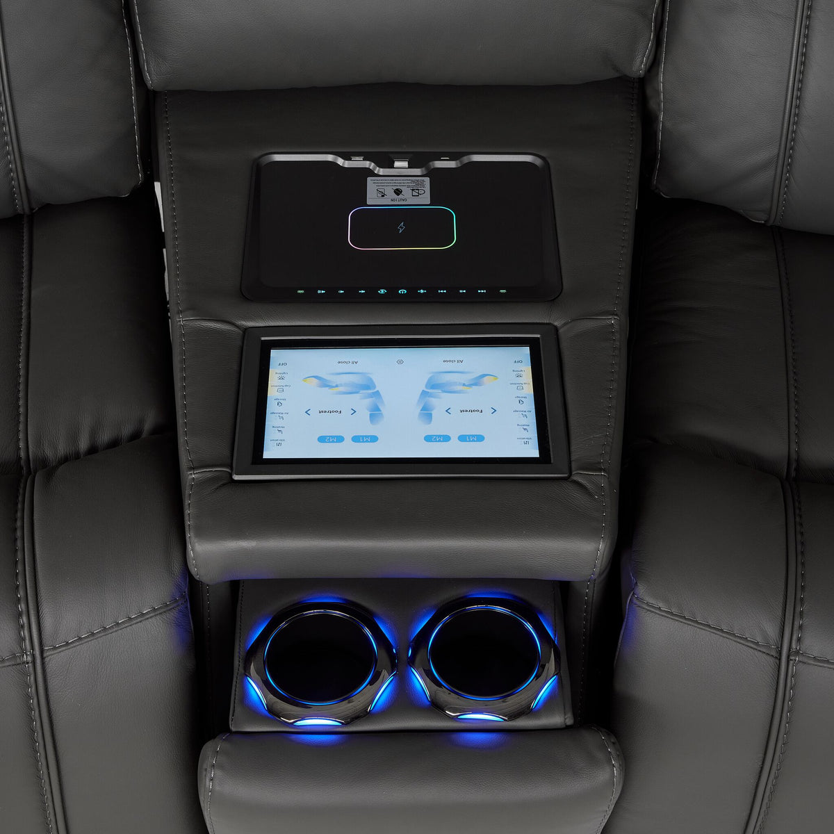 Velocity wedge console close-up showing touchscreen controls, wireless charging pad and illuminated dual cupholders