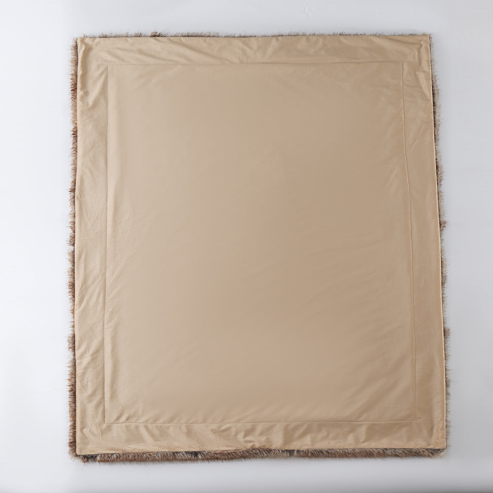 The Great Indoors 50 x 60" faux fur throw laid flat, showing the smooth beige reverse side.