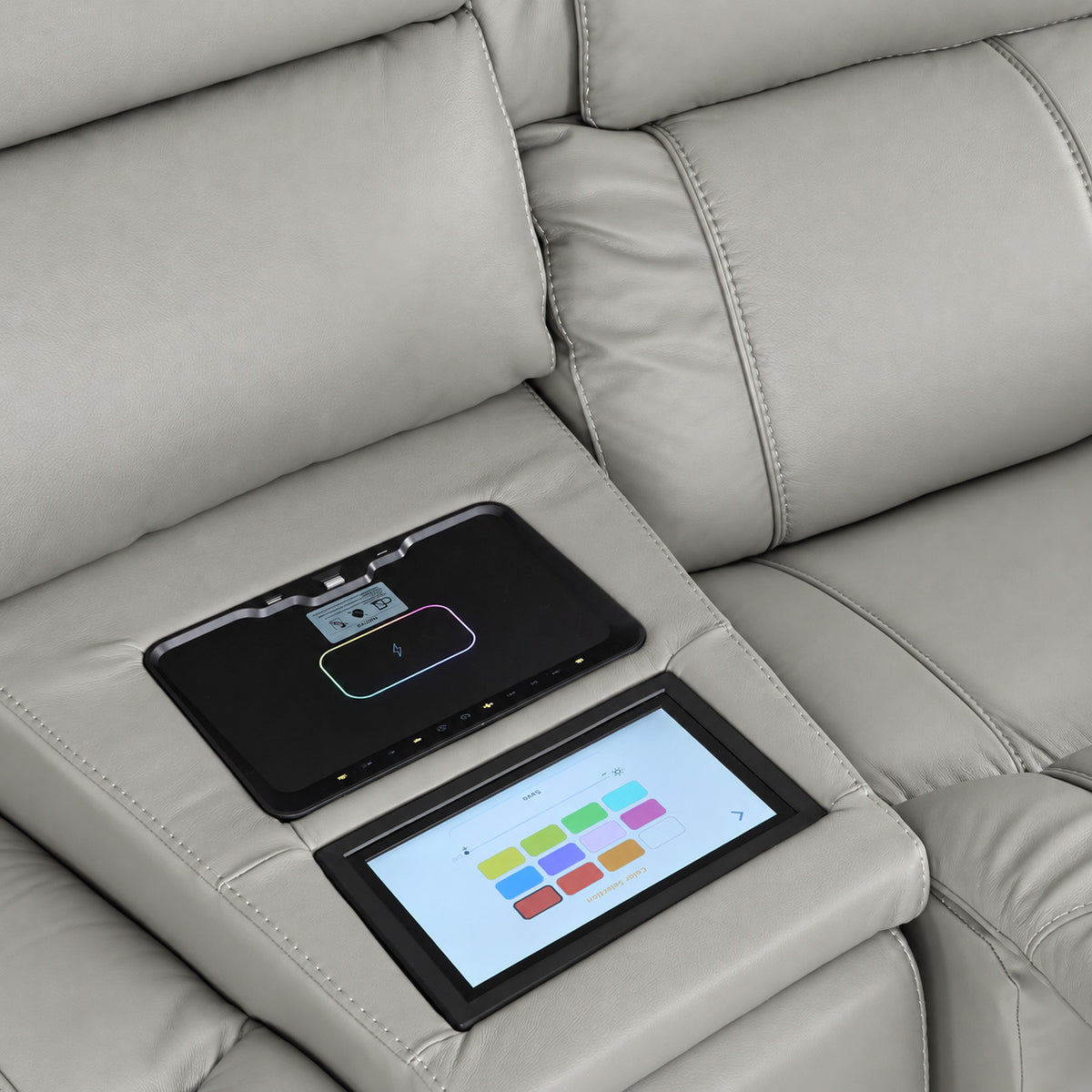Velocity light grey wedge console close-up showing touchscreen colour controls and illuminated wireless charging pad
