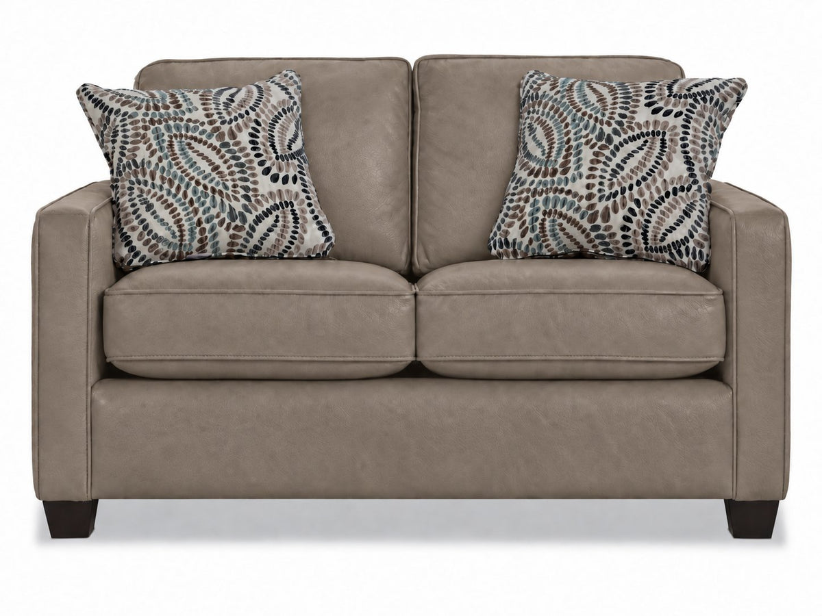 City Leather Loveseat - Stone front view with two seat and back cushions, slim track arms, dark wood legs and two patterned accent pillows