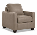 City Leather Chair - Stone in a three-quarter view with a padded back and seat cushion, track arms and dark wood legs