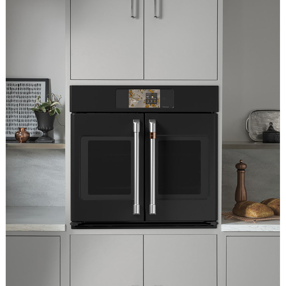 CAFÉ™ Professional Series 30" Matte Black French-Door Wall Oven built into modern kitchen cabinetry