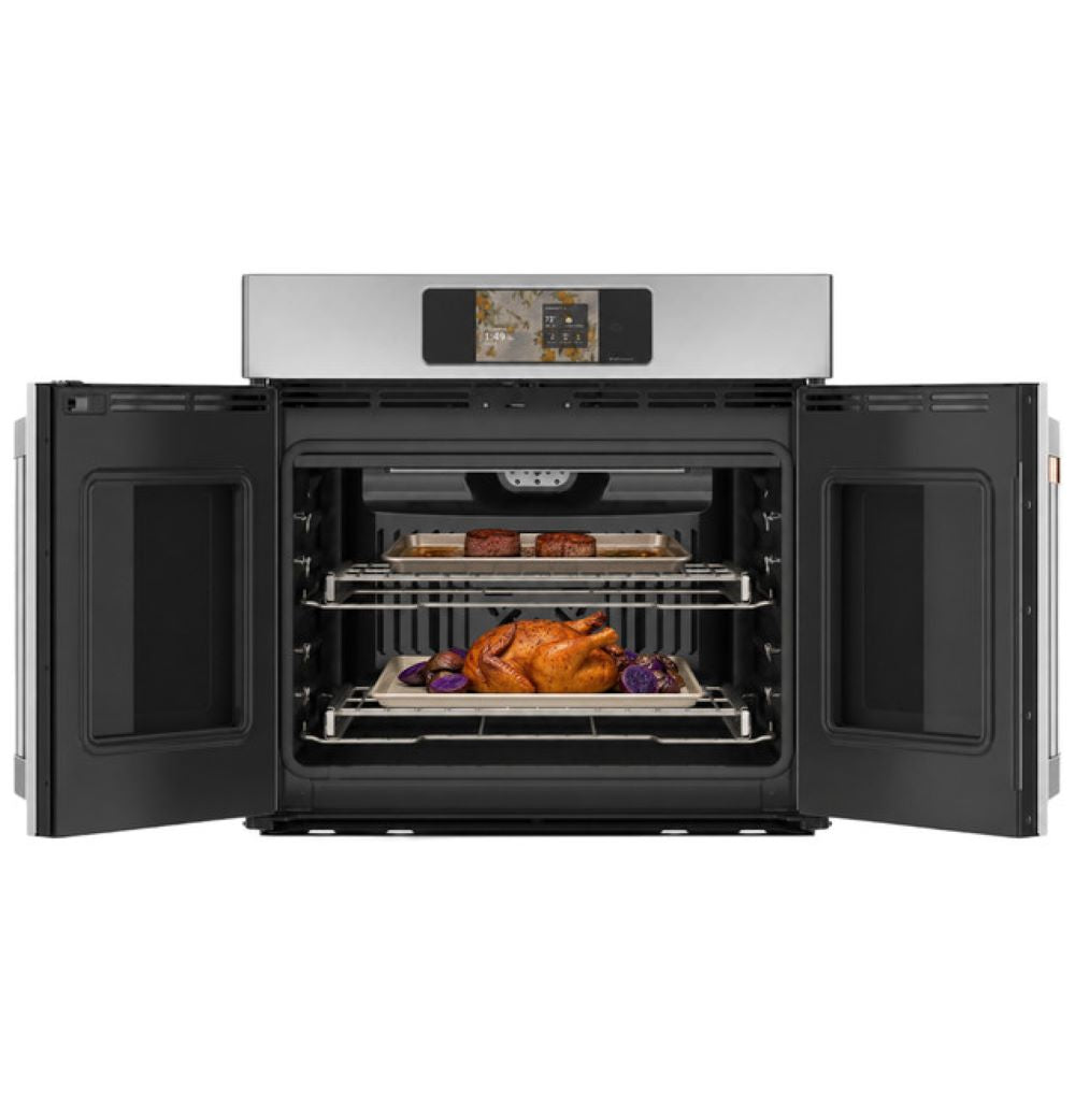 CAFÉ™ Professional Series 30" Stainless Steel French-Door Wall Oven open showing convection fan and two racks