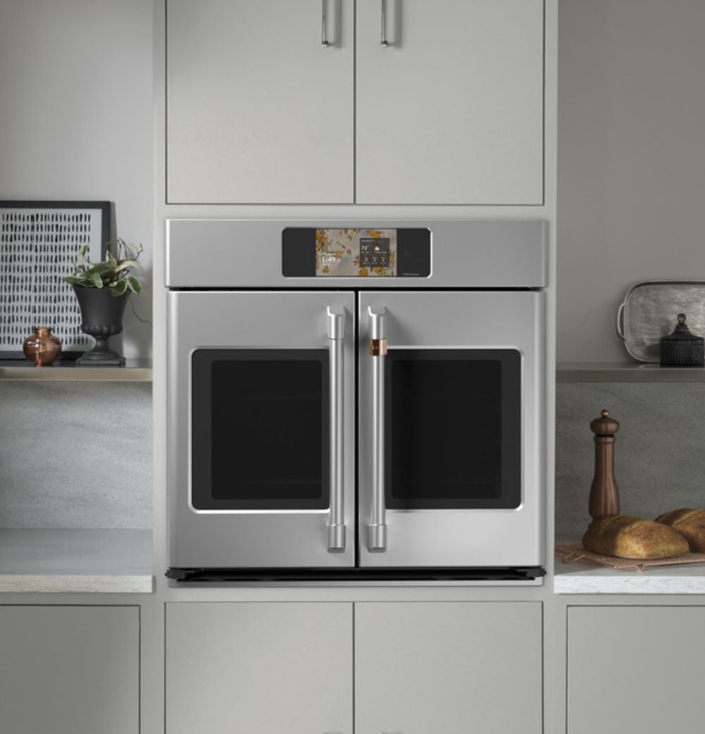 CAFÉ™ Professional Series 30" Stainless Steel French-Door Wall Oven built into modern kitchen cabinetry