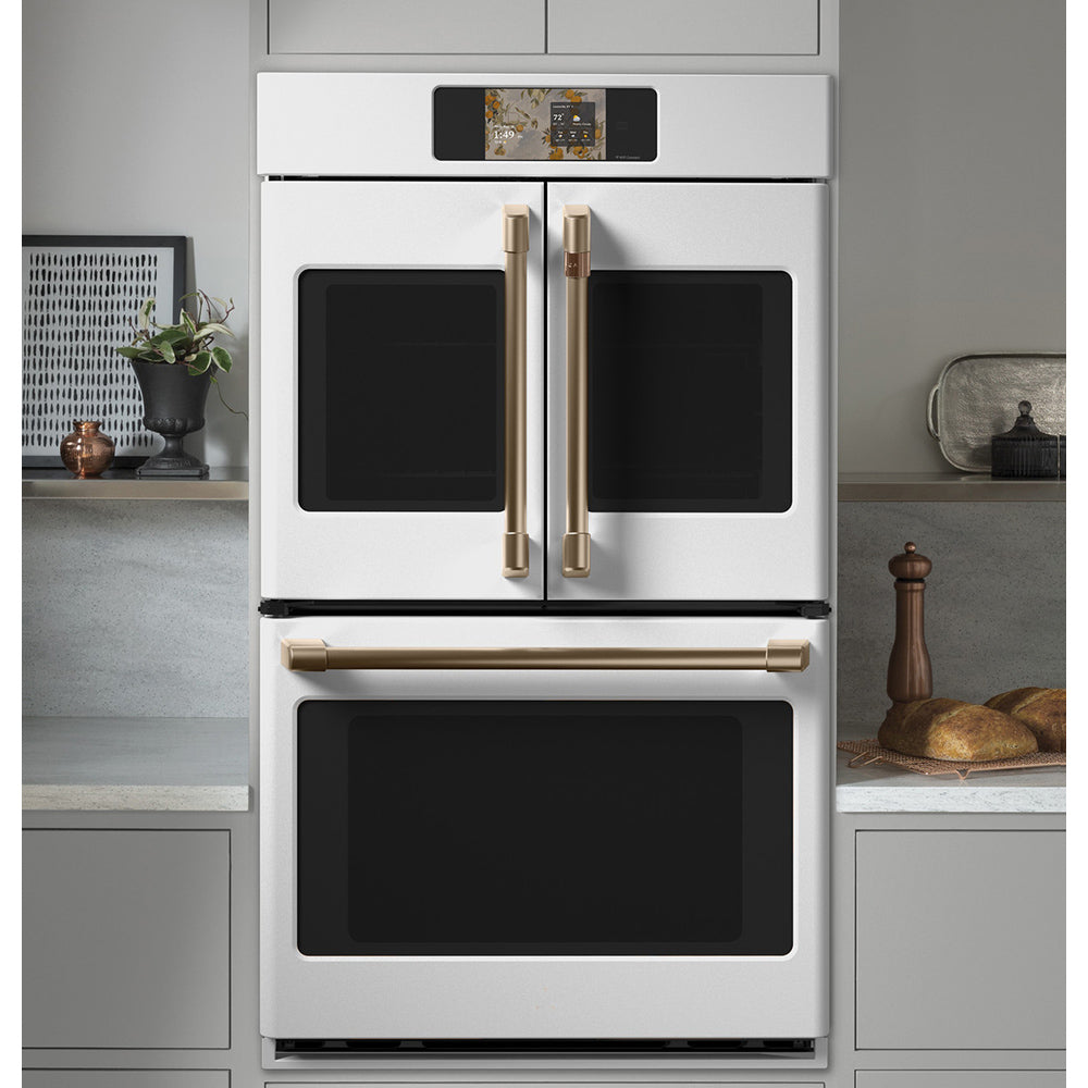 CAFÉ™ 30" Matte White French-Door Double Wall Oven built into modern kitchen cabinetry