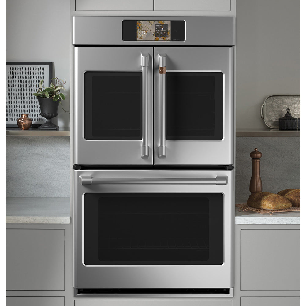 CAFÉ™ 30" Stainless Steel French-Door Double Wall Oven built into modern kitchen cabinetry