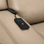 Jackson pristine leather sofa close-up showing wired remote for power recline, heat and massage controls