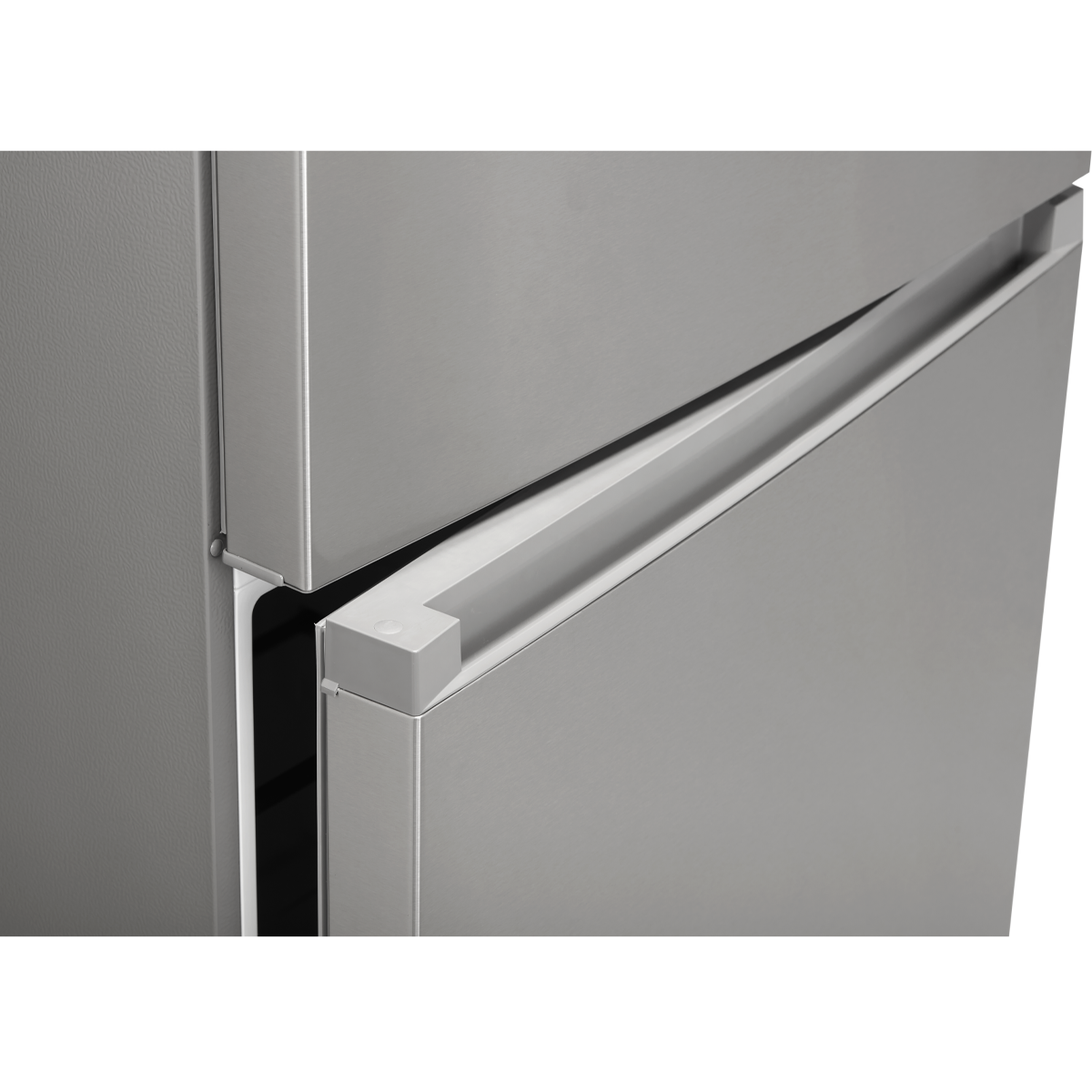 Detail of the recessed handle between the stainless steel freezer and refrigerator doors