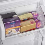 Covered refrigerator door bin holding cheese and packaged foods