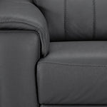 Close-up of the leather chair arm, seat cushion and stitched backrest detail
