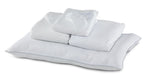 Twin 7-Piece White Dream Bedding Bundle with white pillows, folded bedding and sleep mask arranged together