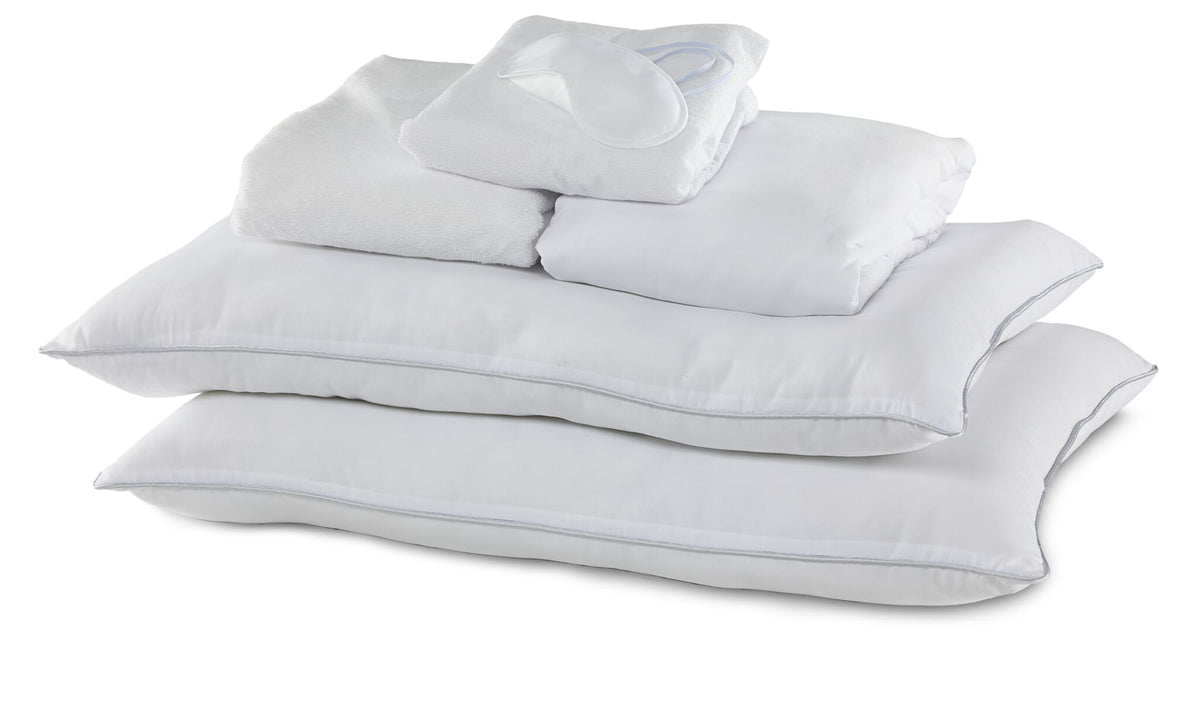 Full 10-Piece White Dream Bedding Bundle with white pillows, folded bedding and sleep mask arranged together