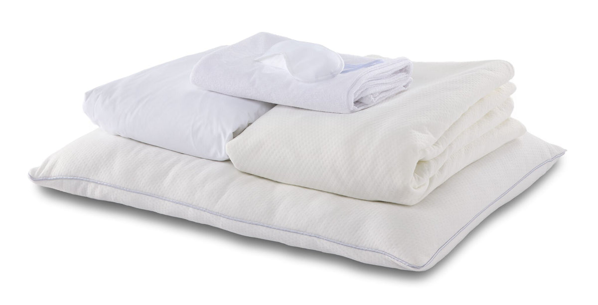 Twin 7-Piece Cool Touch White Dream Bedding Bundle with white pillows, folded bedding essentials and sleep mask