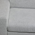Delphine Power Slide-Out Sofa Bed - Off White close-up showing textured upholstery on the seat, backrest and arm
