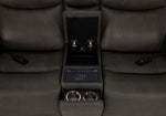 Jackson loveseat centre console close-up showing storage, wireless charging pad and two hidden cupholders