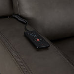 Jackson anthracite leather seating close-up showing wired remote for power recline, heat and massage controls