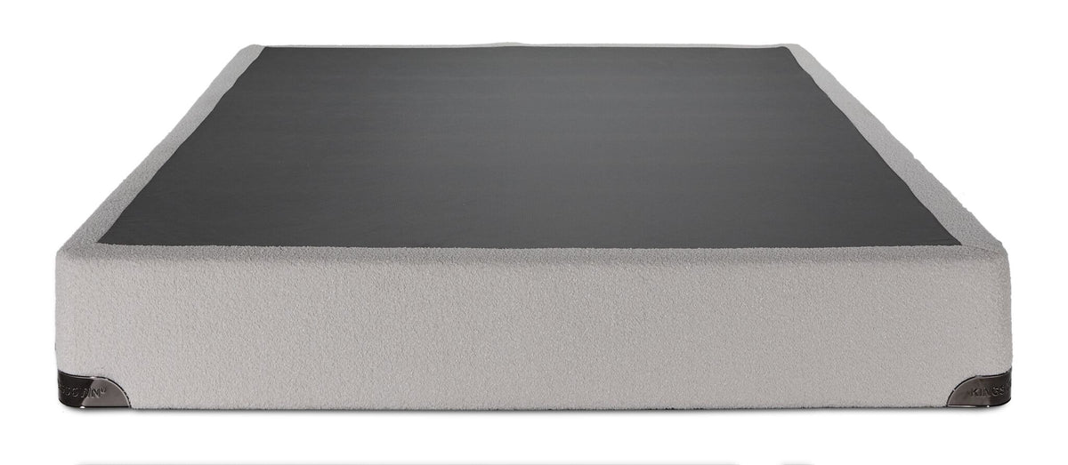 Front view of the Kingsdown White Boucle queen boxspring with beige polyester upholstery and black support surface