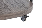 Kosmos coffee table close-up showing dark oak lower shelf and small caster wheel beneath the base