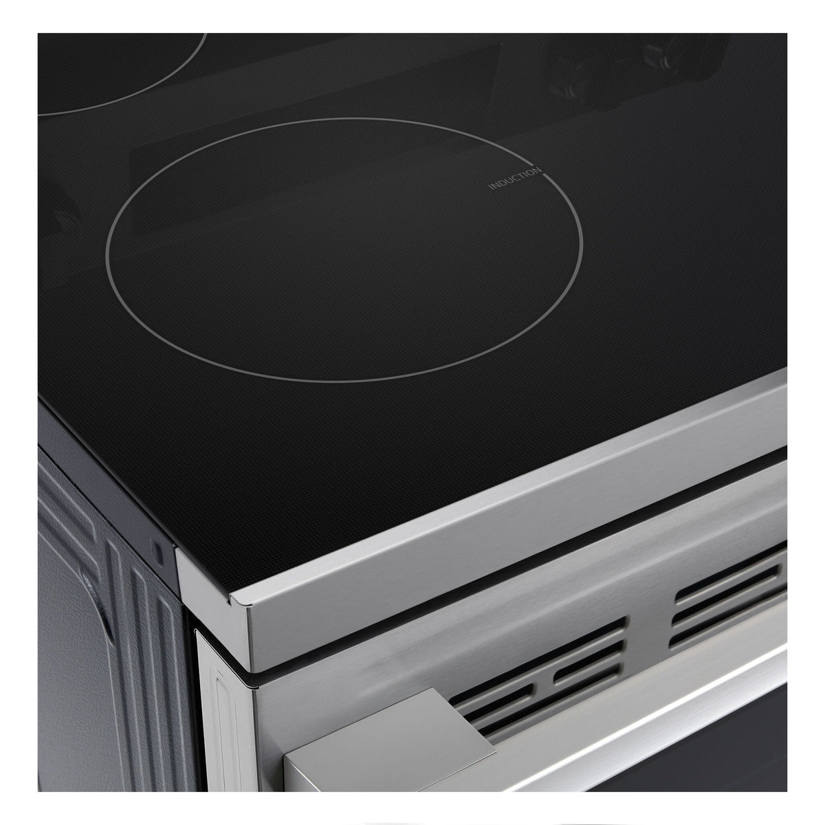 Close-up of LG black glass induction cooktop showing outlined cooking zone and stainless steel front edge