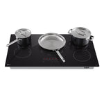 LG Black 36-inch Smart Induction Cooktop with pots and frying pan positioned across multiple induction cooking zones