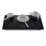 LG Black 36" Smart Induction Cooktop with saucepan, frying pan and stockpot positioned across multiple cooking zones