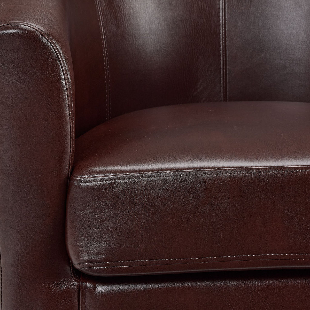 Close-up of the Lincoln Accent Chair - Brown showing smooth upholstery, seat cushion stitching and rounded arm detail