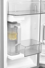 Door-mounted water pitcher positioned beneath the internal dispenser