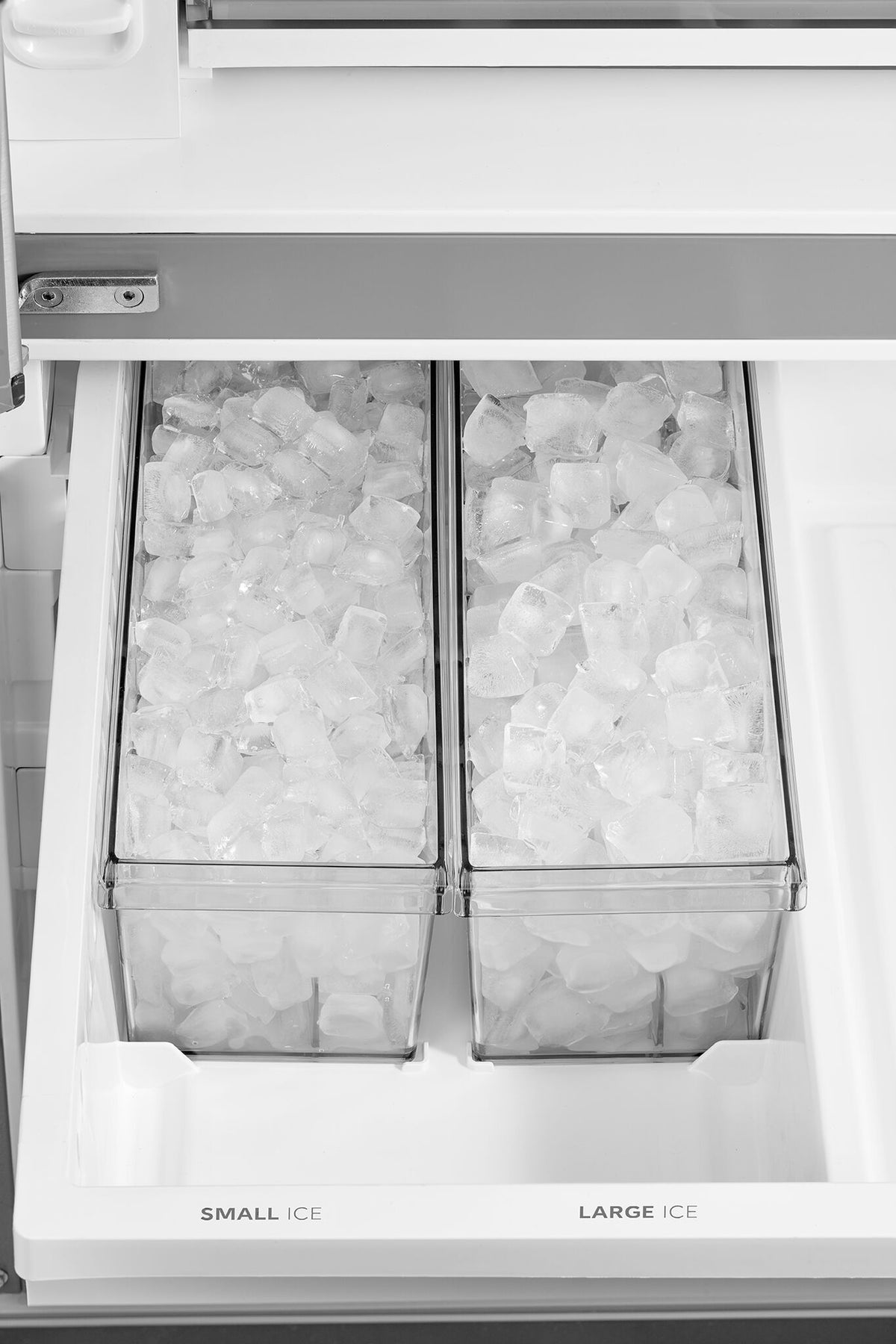 Dual freezer ice bins filled with small and large ice cubes