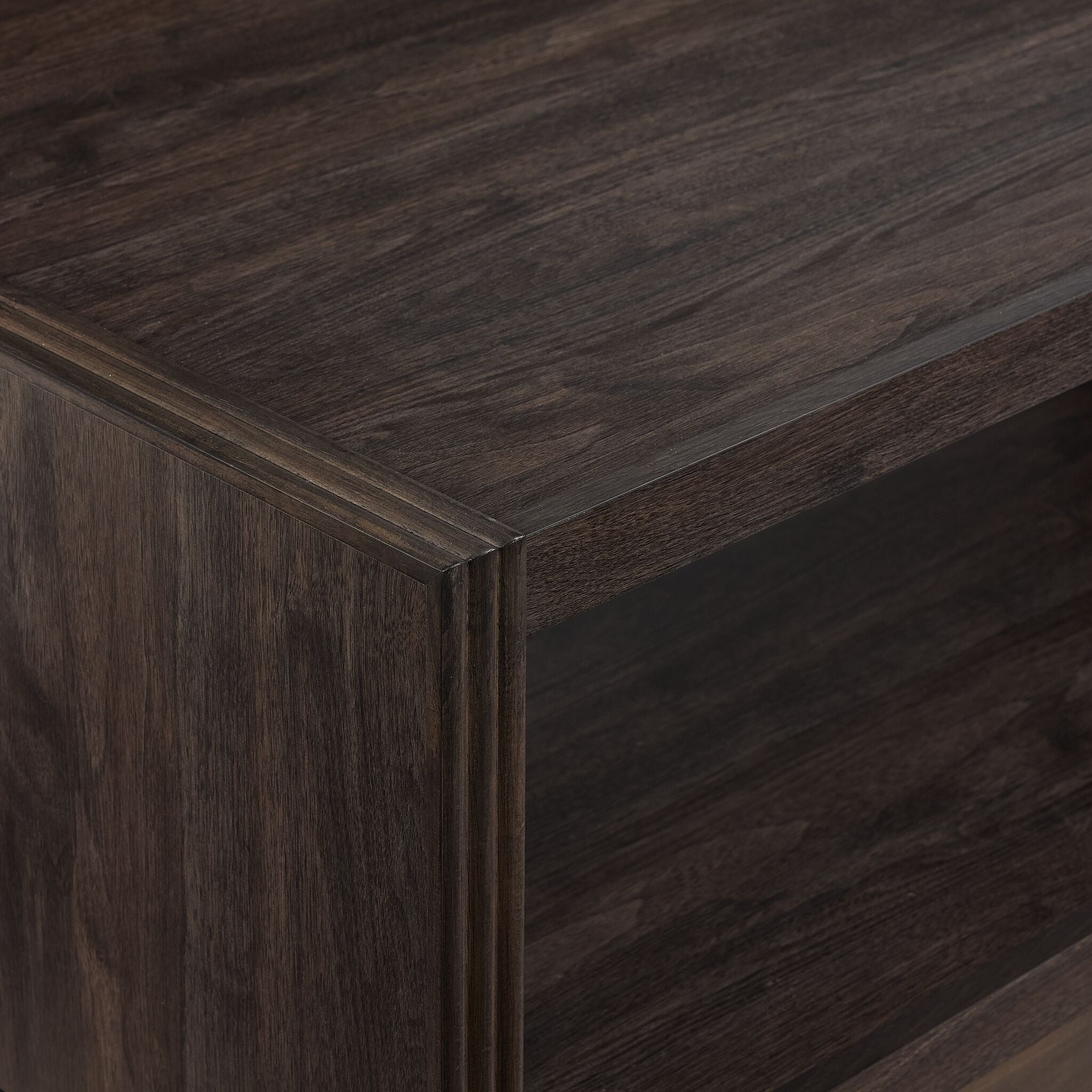 Modern Edge coffee table close-up showing dark grey finish, shelf edge and raised frame detail