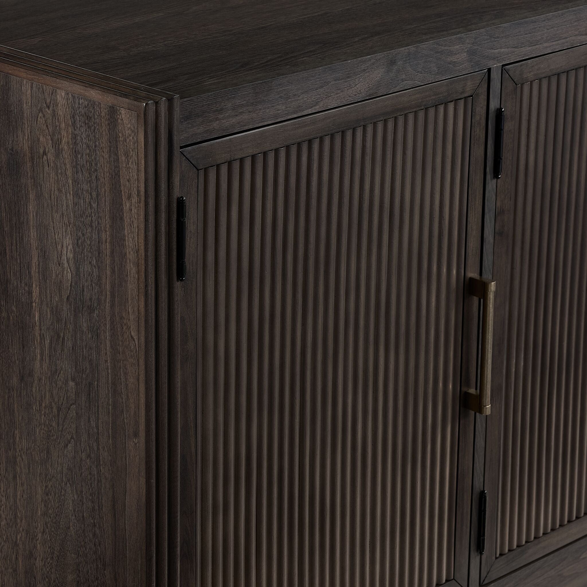 Modern Edge TV console close-up showing dark grey finish, shelf edge and picture frame detail