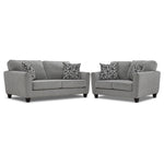 Moncton light grey sofa and loveseat set with flared arms, dark tapered legs and accent pillows