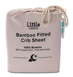 Little Leon’s Bamboo Fitted Crib Sheet in Morganite pink drawstring packaging with 100% bamboo and 250 thread count details