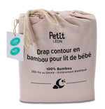 Petit Léon Morganite pink bamboo fitted crib sheet in drawstring packaging with 100% bamboo and 250 thread count details