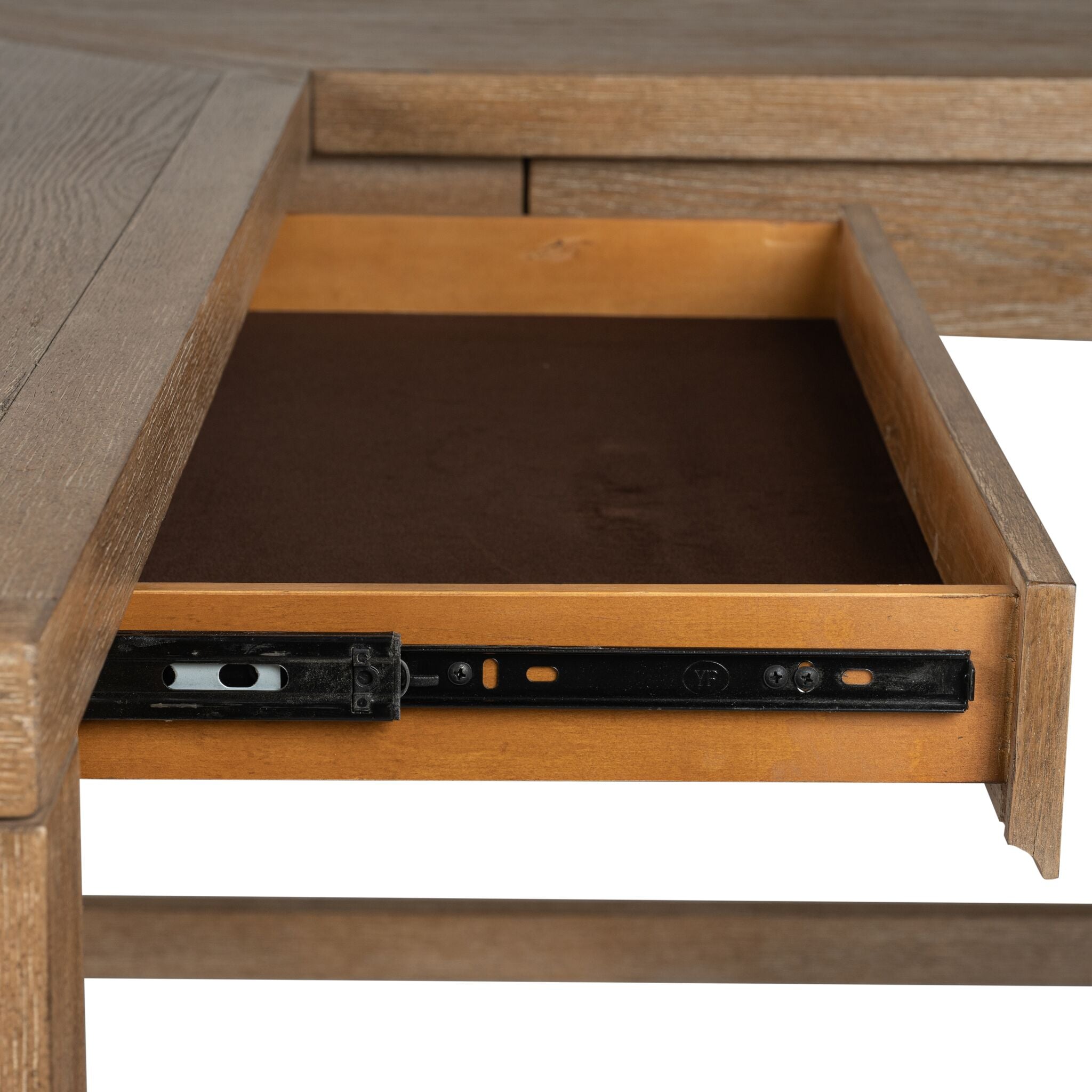Plum Creek corner desk close-up showing open centre drawer, drawer glide hardware and Sierra Brown wood finish