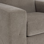 Valetta Chair - Wheat close-up showing textured upholstery and decorative cross stitching on the wide track arm