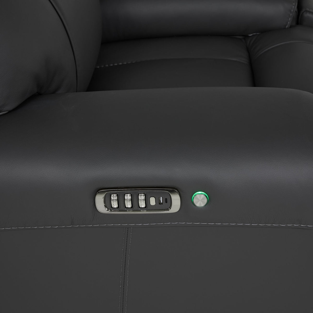 Velocity recliner close-up showing power control buttons, USB charging port and illuminated round control