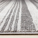 Zola 6'7" x 9'6" Patterned Rows Area Rug - Grey, White, Black