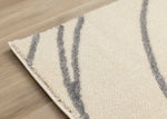 Sully 6'7" x 9'6" Circle Swirl Area Rug - Cream