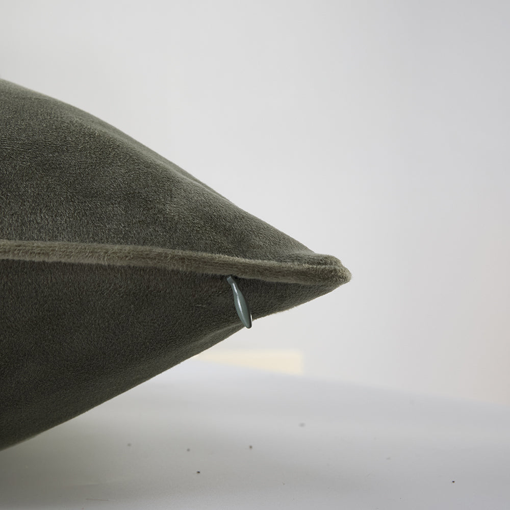 Close-up of The Great Indoors 18 x 18" Green Velvet Cushion showing soft velvet fabric, piped edge and concealed zipper