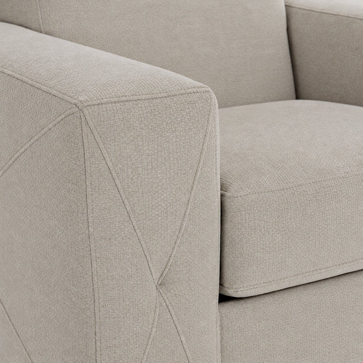 Valetta Chair - Ivory close-up showing textured upholstery and decorative cross stitching on the wide track arm