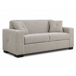 Valetta Sofa - Ivory angled view with two seat cushions, wide track arms, dark block feet and two matching accent pillows